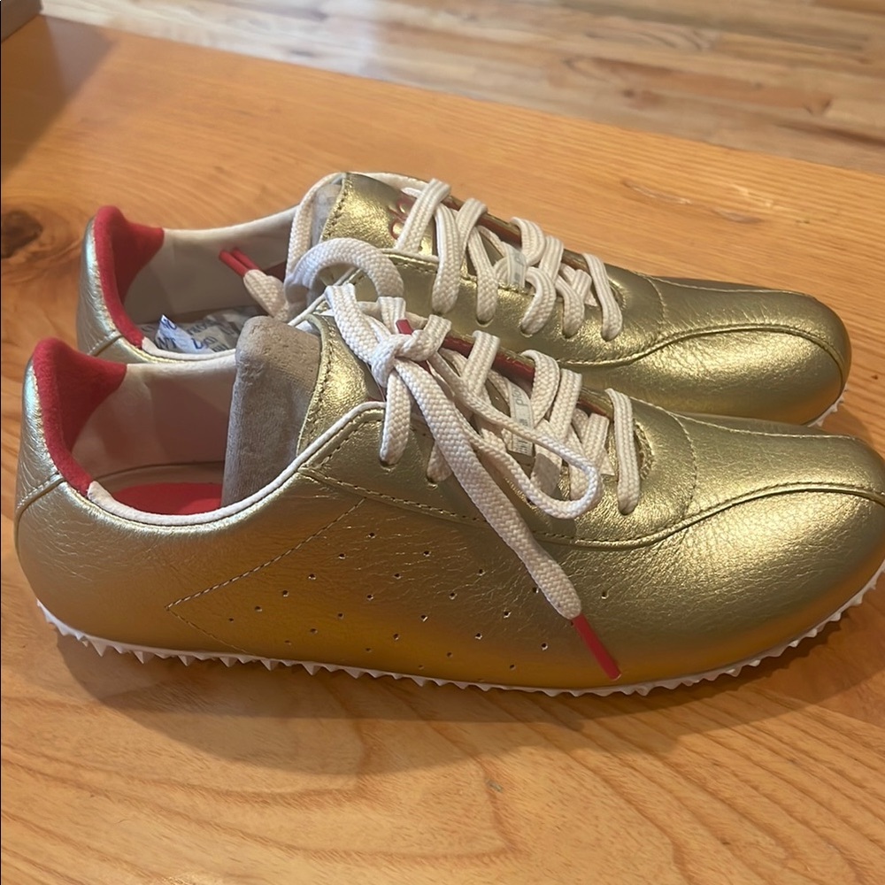 PLAE Gold Sneakers with Red Highlights